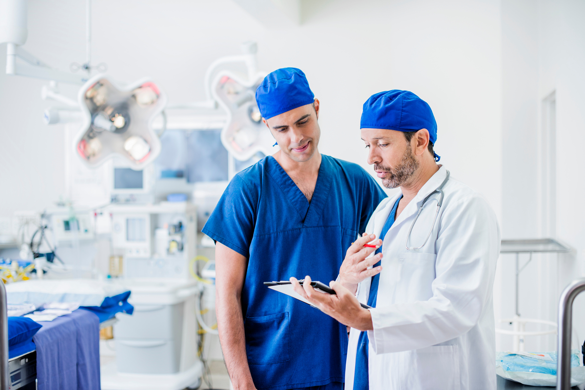 Two doctors comparing notes before surgery