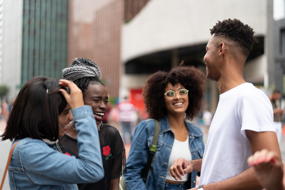 Group of friends hanging out in a city scape street