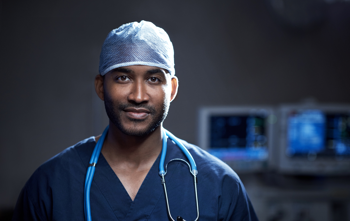 Portrait of a confident young surgeon standing in an operating room